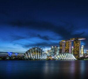 Singapore skyline at Marina Bay featuring Marina Bay Sands and Gardens by the Bay at night