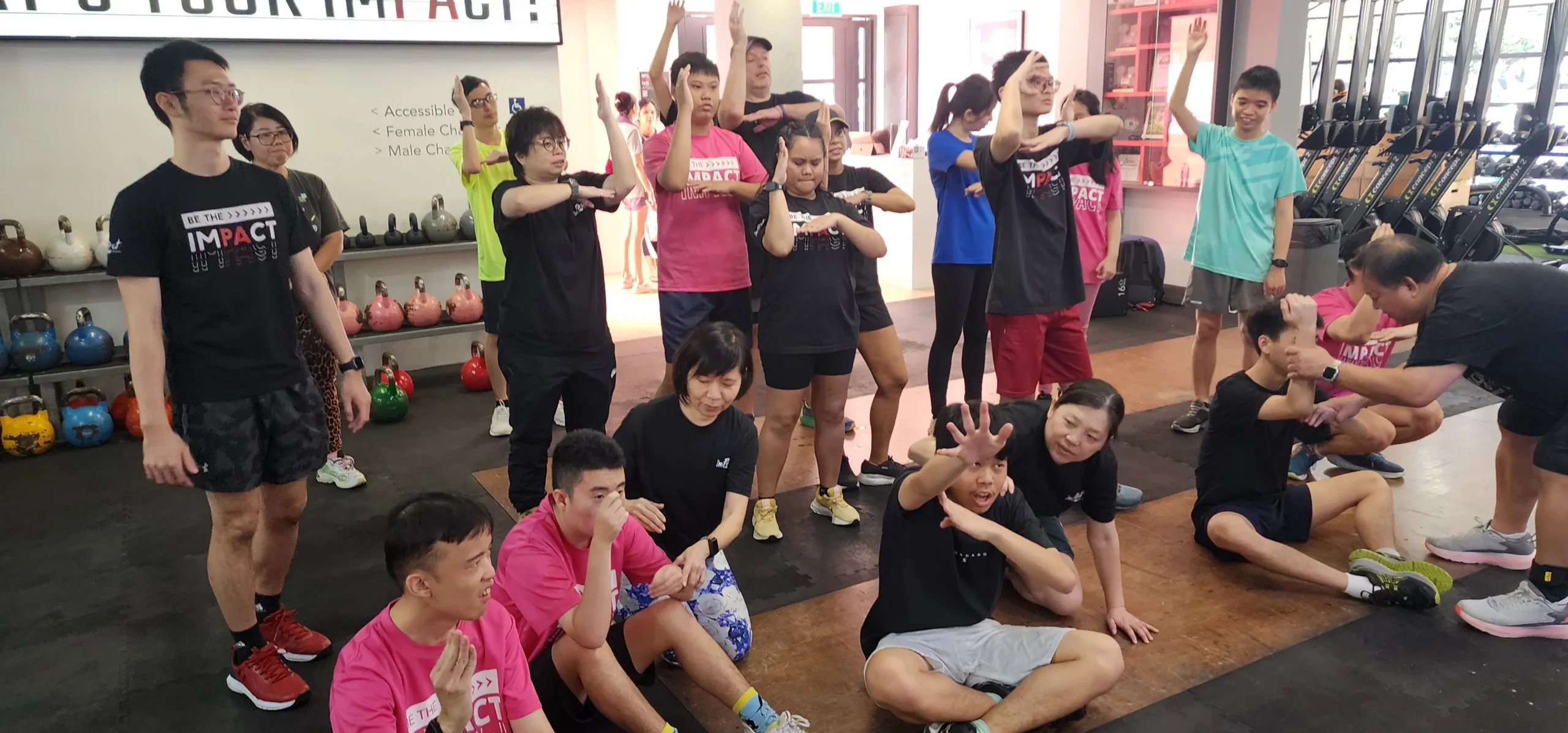 Group of volunteers and participants at adaptive fitness programme in Impact Hong Lim Singapore