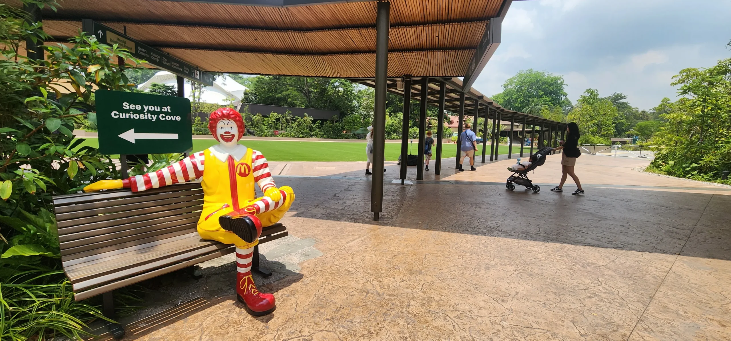 Ronald McDonald bench statue near Curiosity Cove at Mandai Wildlife Reserve walkway