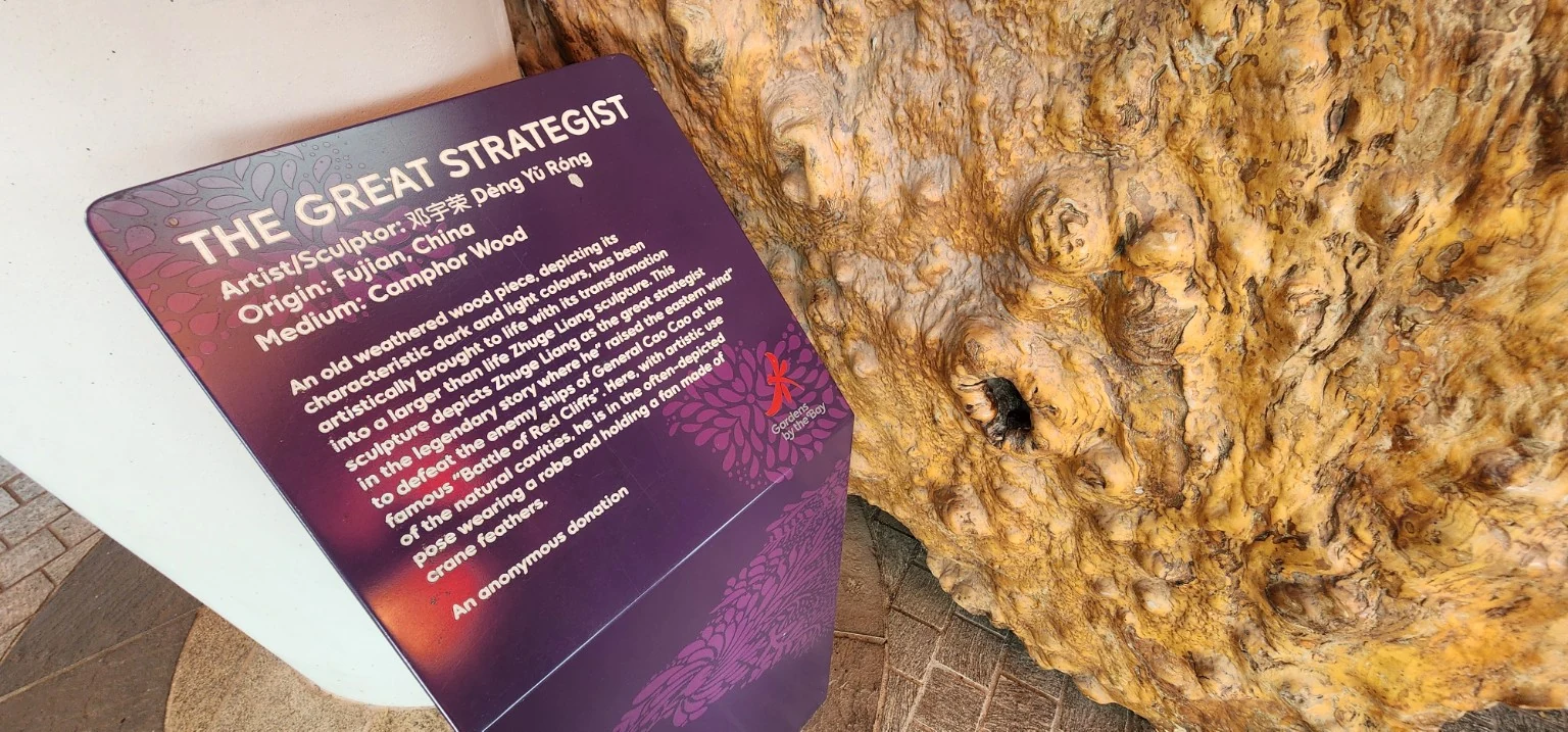 The Great Strategist plaque describing camphor wood sculpture