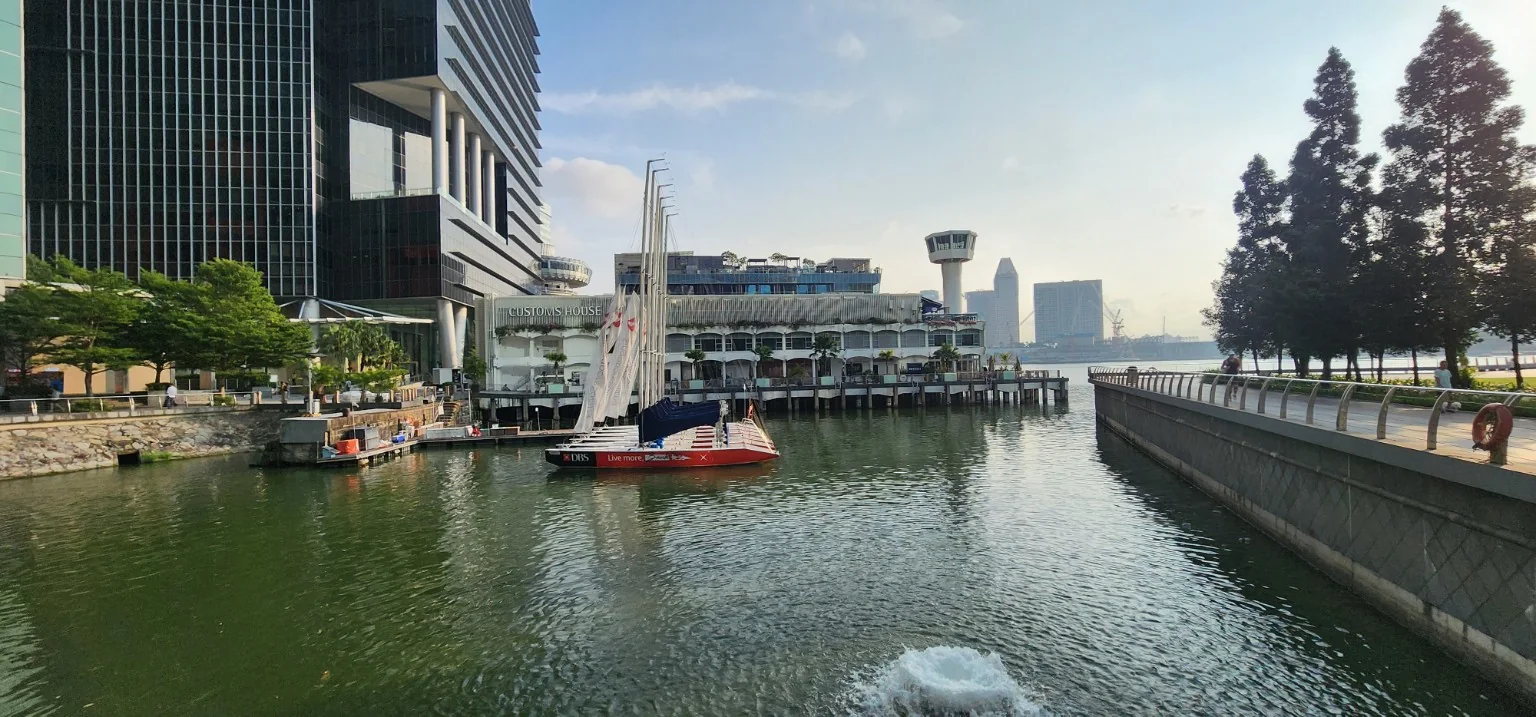 Fullerton Bay waterfront with Customs House and a sailing boat