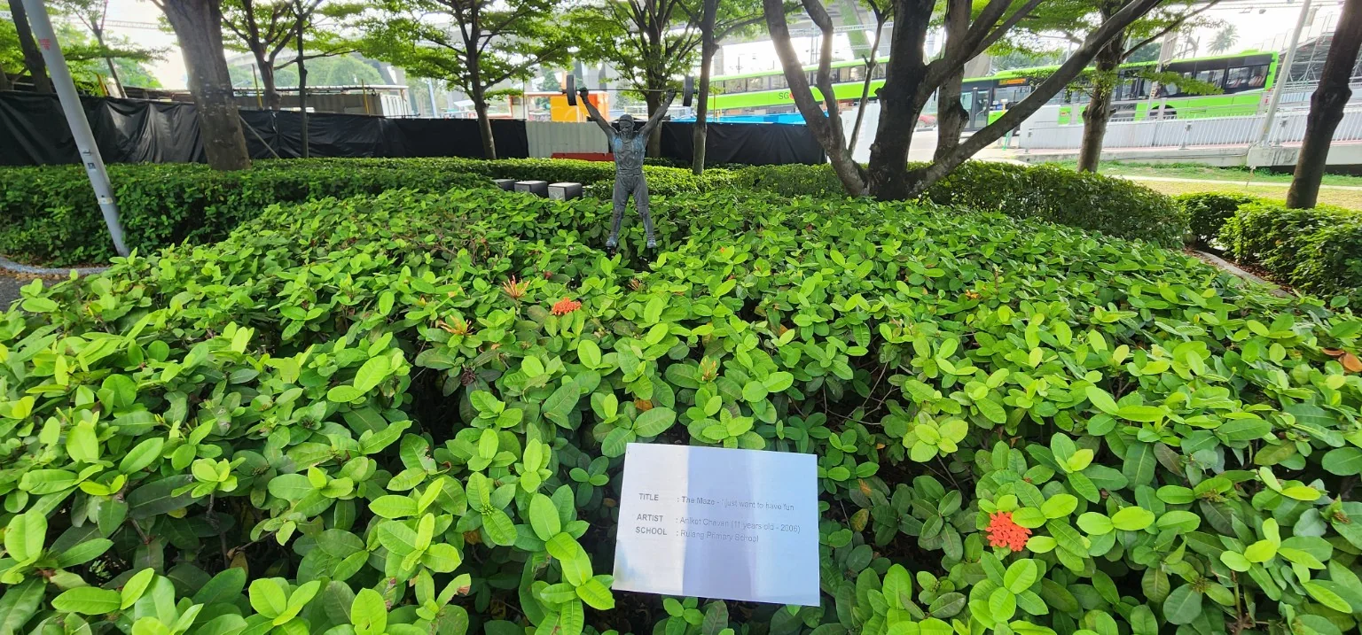 The Maze public artwork surrounded by greenery