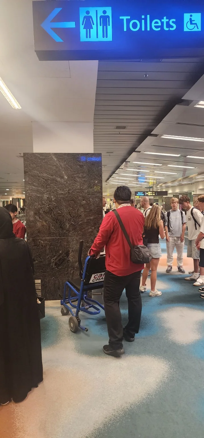 Airport wheelchair mobility assistance for travellers