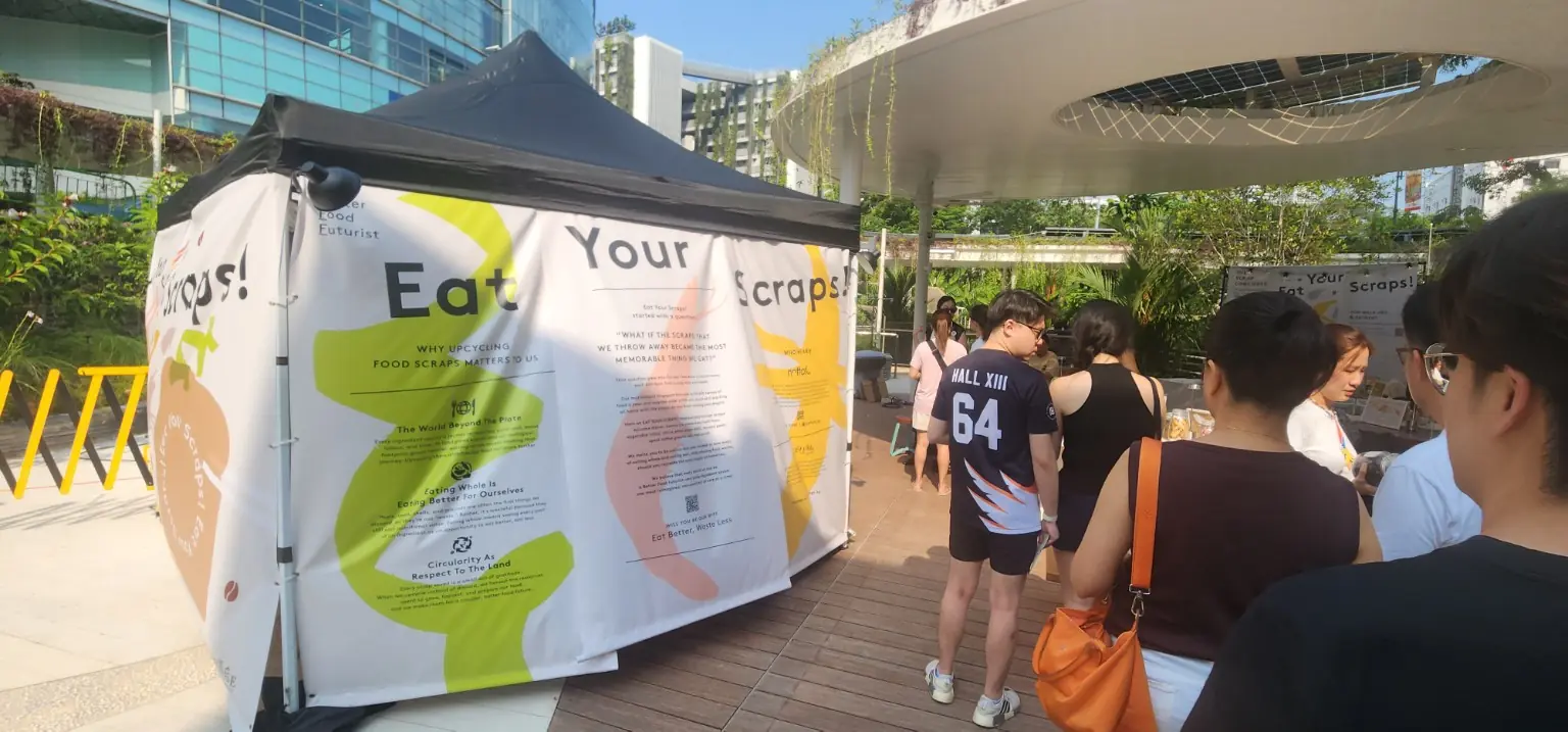 Visitors exploring sustainability activities in the outdoor community space at GREEN-HOUSE Festival 2026