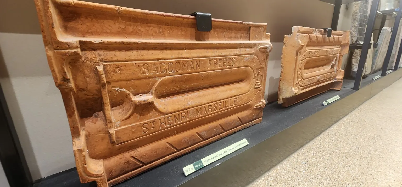 Preserved 1920s Marseille roof tiles displayed inside Temasek Shophouse