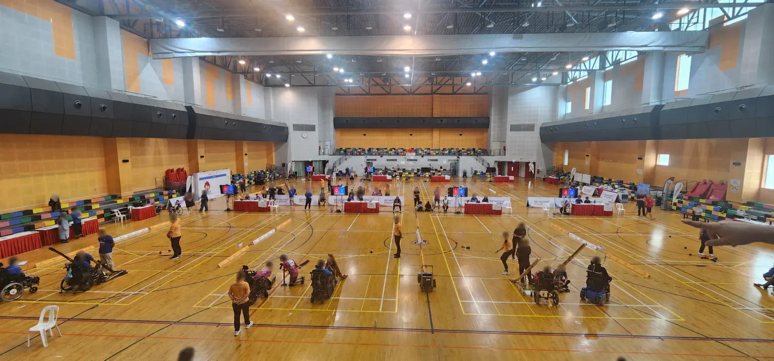 Wide view of multiple boccia courts operating inside ActiveSG Pasir Ris Sport Centre
