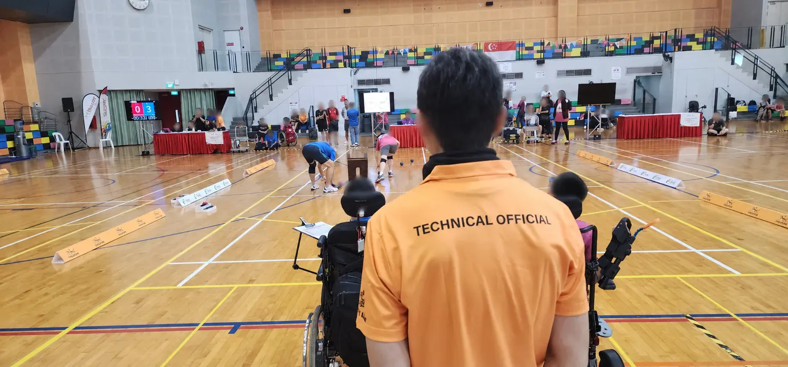 Boccia technical official overseeing court play during Pesta Sukan