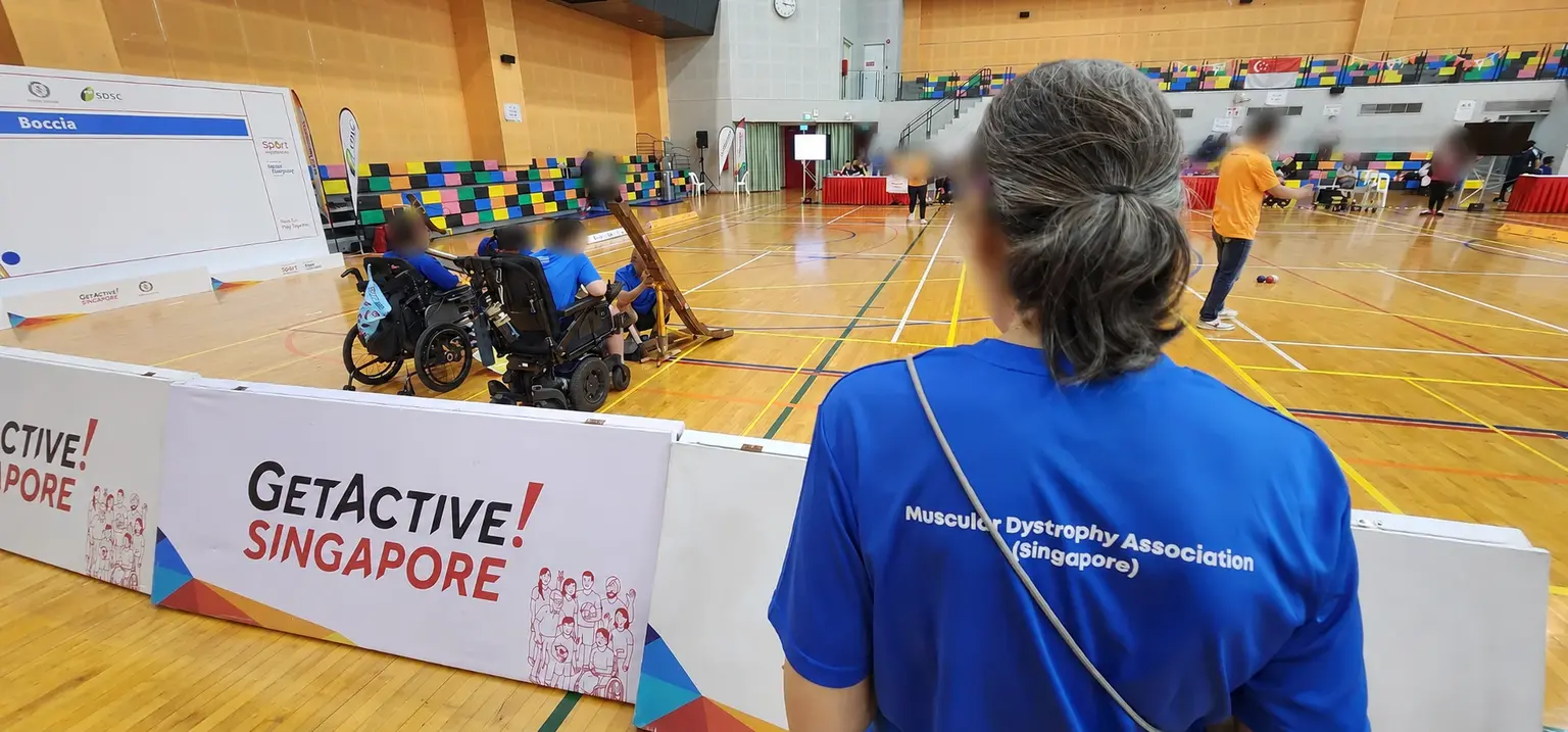 Community supporter observing a boccia match at Pesta Sukan in Singapore