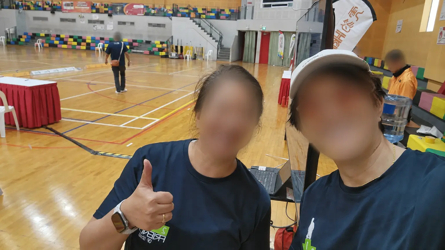 Two people sharing a personal moment during the Pesta Sukan boccia event