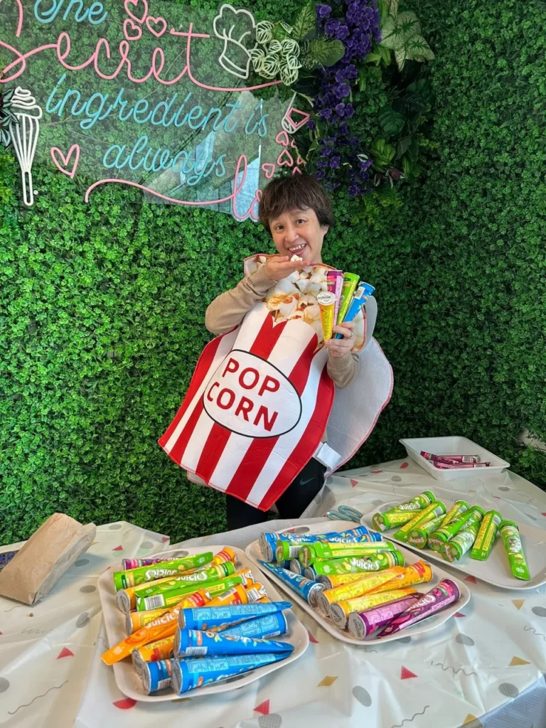 Christina Tan (Ms Chris), Principal of MindChamps PreSchool at JTC Summit in Jurong East, smiling in a popcorn costume.