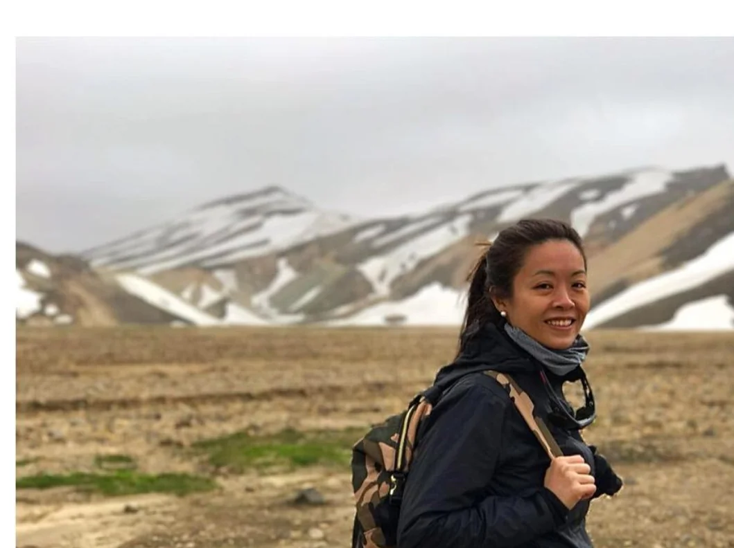 Personal photograph of Jocelyn Goh in a mountainous landscape with snow in the background