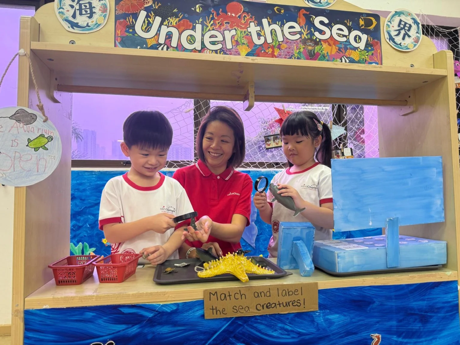Children exploring hands-on discovery activities at MindChamps Thomson